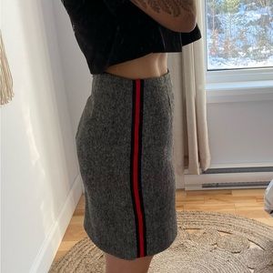 Icone wool mini skirt with zip at the back and stripe details on both sides